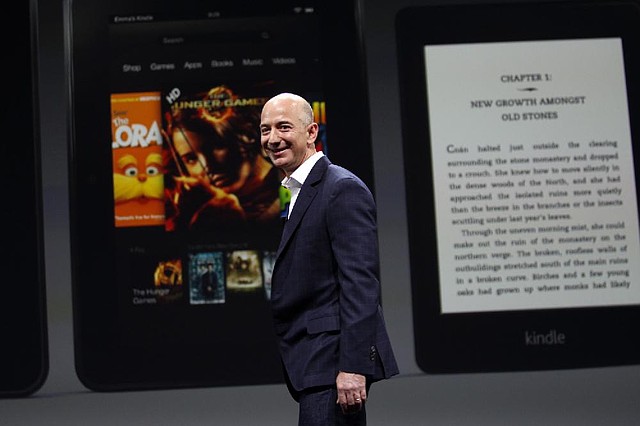 Jeff Bezos, chief executive officer of Amazon.com Inc., leaves the stage after introducing the Kindle Paperwhite and the Kindle Fire HD tablets at a news conference last September. While Amazon has opened a store in China, it is unable to sell Kindle tablets to Chinese consumers. 