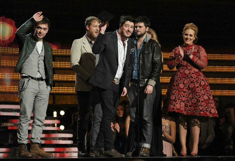 Mumford & Sons accepts the award for album of the year at the 55th annual Grammy Awards in Los Angeles in this 2013 file photo. 