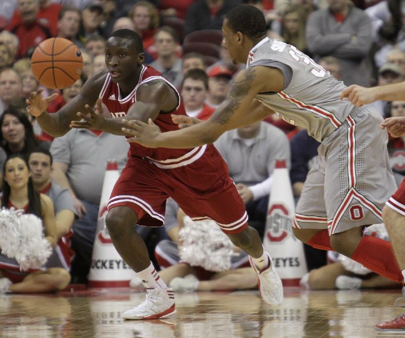 Indiana guard Victor Oladipo (left) grabs a loose ball from Ohio State guard Lenzelle Smith during the second half of Sunday’s game in Columbus, Ohio. Oladipo scored a career-high 26 points as Indiana defeated Ohio State 81-68. 
