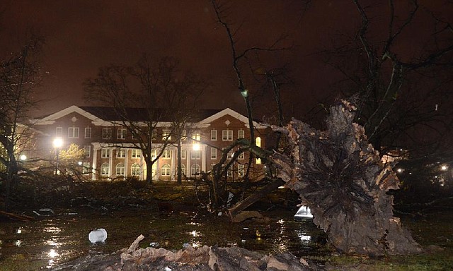 Trees are uprooted in front of the University of Southern Mississippi on Sunday after a tornado went through Hattiesburg, Miss. 