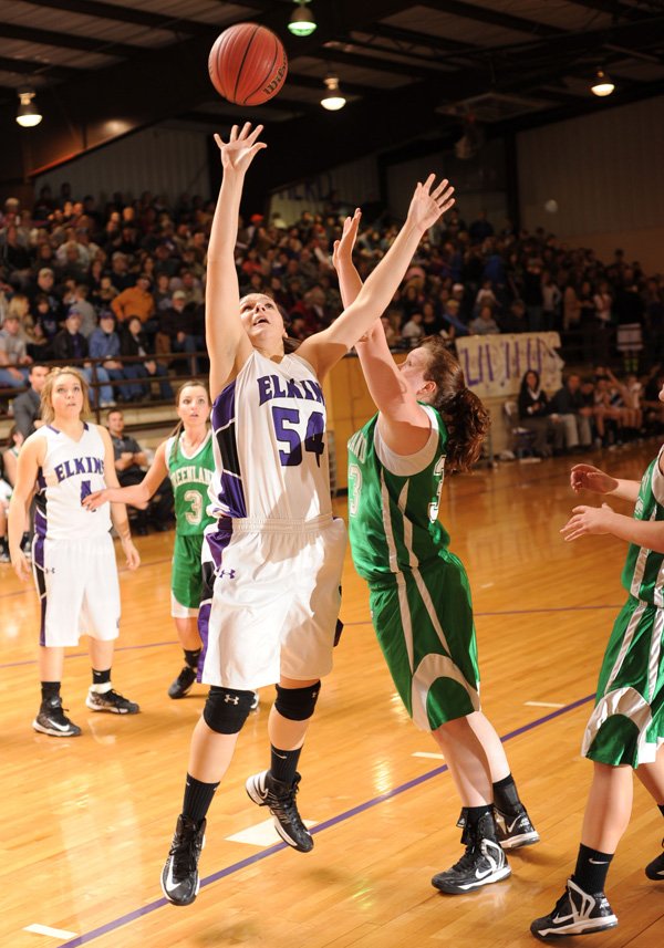 Mariah Hendrix, Elkins sophomore, shoots Feb. 1 as Greenland’s Mackenzie Brown at Elkins High. 