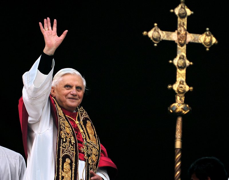 This April 19, 2005, file photo shows Pope Benedict XVI greeting the crowd from the central balcony of St. Peter's Basilica moments after being elected, at the Vatican. On Monday, Feb. 11, 2013, Benedict XVI announced he would resign Feb. 28, the first pontiff to do so in nearly 600 years. 