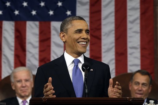 President Barack Obama, flanked by Vice President John Biden and House Speaker John Boehner smiles as he gives his State of the Union address during a joint session of Congress on Capitol Hill in Washington, Tuesday Feb. 12, 2013.