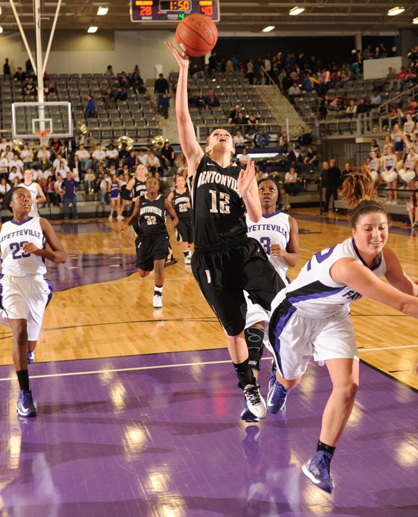 Bentonville's Taylor Lee (12) reaches to score as Fayetteville's Taylor Crockett defends during the second half Friday, Jan. 25, 2013, at Fayetteville High.