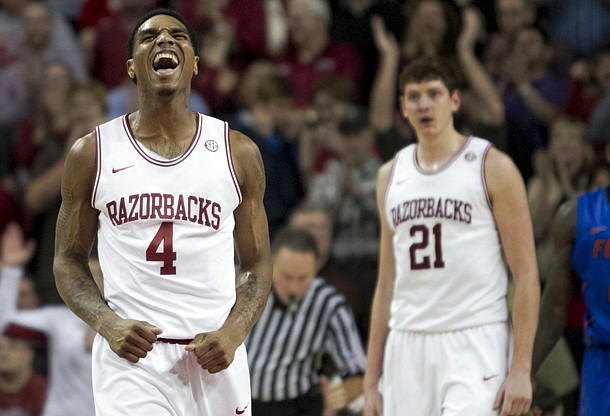 Arkansas' Coty Clarke (4) celebrates during the second half of the Razorbacks' 80-69 win over Florida in Tuesday, Feb. 5, 2013. A few more quality victories may be all Arkansas needs to make the NCAA Tournament.