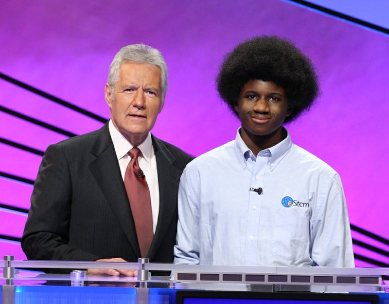 EStem senior Leonard Cooper is pictured with Jeopardy! host Alex Trebek in this photo provided by the popular quiz show.