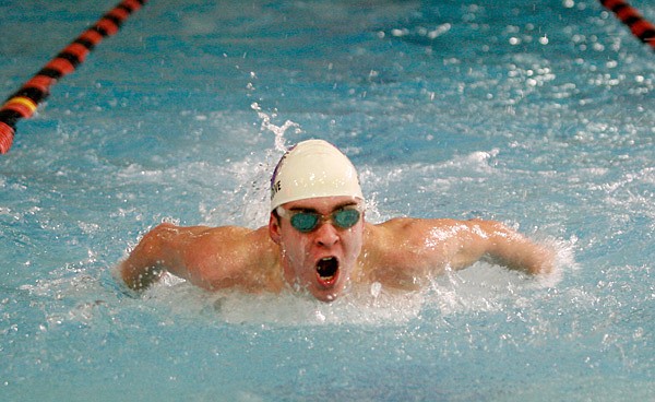 Fayetteville’s Ben Heil competes in the 100 butterfly on Jan. 31 during the Bentonville High School Invitational Meet inside The Jones Center in Springdale. 