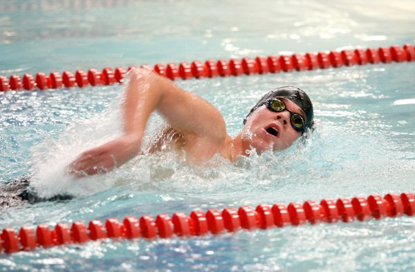 Springdale Har-Ber’s John Kirchner competes in the 500-yard freestyle on Jan. 31 during the Bentonville Invitational Meet. 