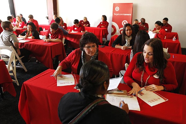 In this Thursday, Jan. 10, 2013 photo, prospective candidates are interviewed for job openings at a Target job fair in Los Angeles. On Tuesday, Feb. 12, 2013, the Labor Department releases the job openings and labor turnover survey for December. The last report showed that overall hiring was largely unchained in November. (AP Photo/Damian Dovarganes)