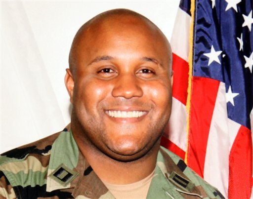 This undated file photo provided by the Los Angeles Police Department shows suspect Christopher Dorner, a former Los Angeles police officer. A law enforcement official tells The Associated Press, Tuesday, Feb. 12, 2013, that a charred body inside the ruins of a mountain cabin that went up in flames is believed to be that of Dorner, suspected in four killings. Other agencies say a body has yet to be found.
