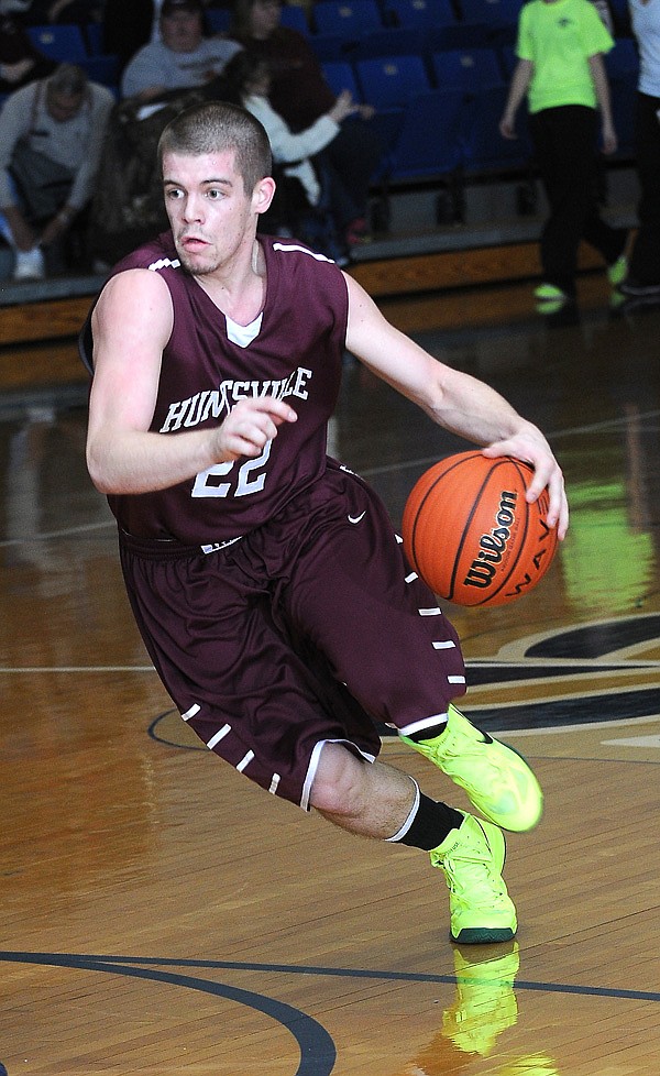 Cole Frick of Huntsville High School drives towards the lane Tuesday, Feb. 12, 2013, during the game against Shiloh Christian School at Champions Gym in Springdale.
