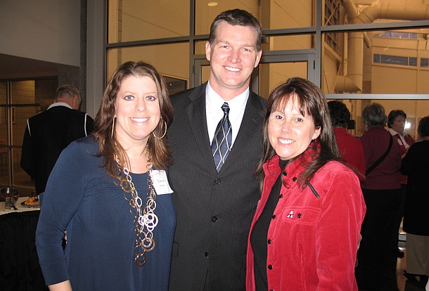 Sean Rochelle, center, grew up in Arkansas and has Chris Wyrick's support to take over as the executive director.