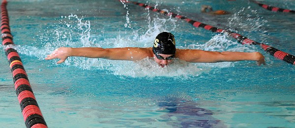 John Hedgecock of Bentonville swims the fly in the 200-yard medley relay Wednesday during the NWA Conference swim meet at The Jones Center in Springdale. 