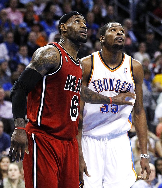 Miami Heat forward LeBron James (left) had 39 points, 12 rebounds and 7 assists to beat Kevin Durant (right) and the Oklahoma City Thunder 110-100 on Thursday night. 