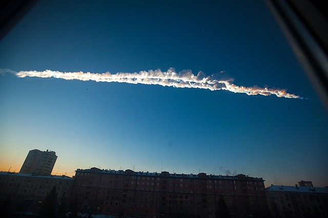 In this photo provided by Chelyabinsk.ru, a meteorite contrail is seen over Chelyabinsk on Friday, Feb. 15, 2013. A meteor streaked across the sky of Russia’s Ural Mountains on Friday morning, causing sharp explosions and reportedly injuring hundreds of people, including many hurt by broken glass. 