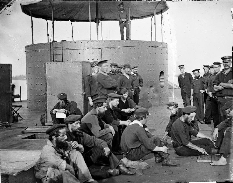 The crew of the USS Monitor sit on the deck of the ship in this undated photograph. The  ship sank off the North Carolina coast on Dec. 31, 1862. The remains of two Yankee sailors found in the ship’s turret will be buried on March 8, 2013, at Arlington Cemetery. Their identifies are not known. Illustrates MONITOR-BURIAL (category a), by Michael E. Ruane, (c) The Washington Post. Moved Tuesday Feb. 12, 2013. (MUST CREDIT: Library of Congress)