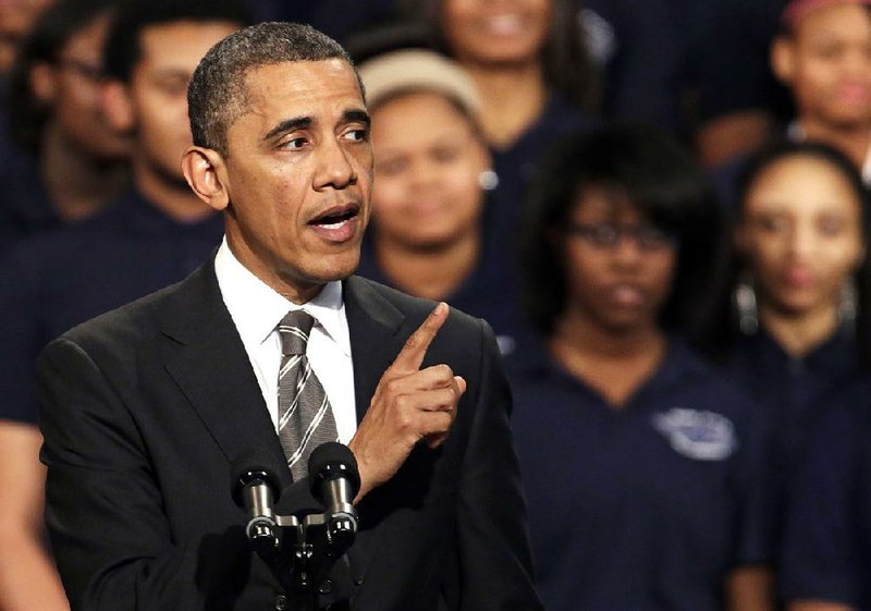 President Barack Obama speaks Friday about strengthening the economy for the middle class and gun violence at an appearance at Chicago’s Hyde Park Academy. 