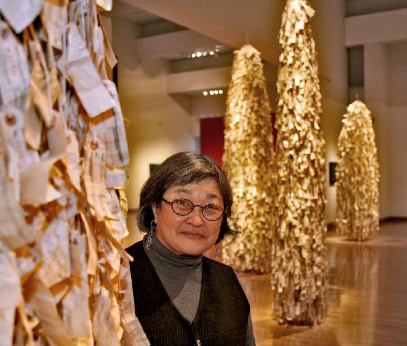 Wendy Maruyama of San Diego created the Arkansas Arts Center’s exhibit of wraith-like paper sculptures representing Japanese-American citizens confined in camps during World War II. Called “The Tag Project,” the 10 sculptures are made from thousands of replica identification tags. “People can see how many Americans were affected during the war,” Maruyama says, but “few people knew about it.” 