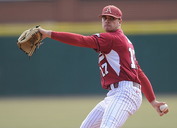 Arkansas pitcher Barrett Astin delivers a pitch Saturday, Feb. 16, 2013, during the second inning of the Hogs' win over Western Illinois at Baum Stadium in Fayetteville.