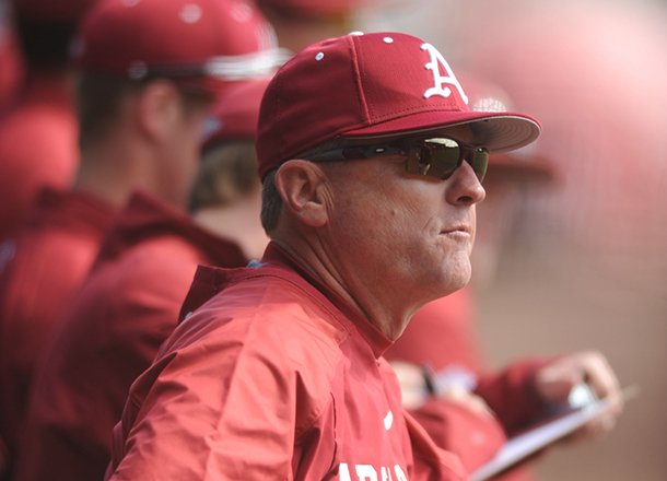 Arkansas coach Dave Van Horn directs his players Saturday, Feb. 16, 2013, during the third inning of the Hogs' win over Western Illinois at Baum Stadium in Fayetteville.