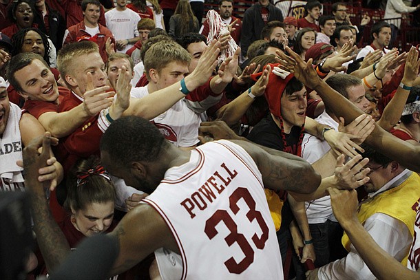 Arkansas forward Marshawn Powell celebrates with the student section following Arkansas' 73-71 win over Missouri. (AP Photo/Gareth Patterson)