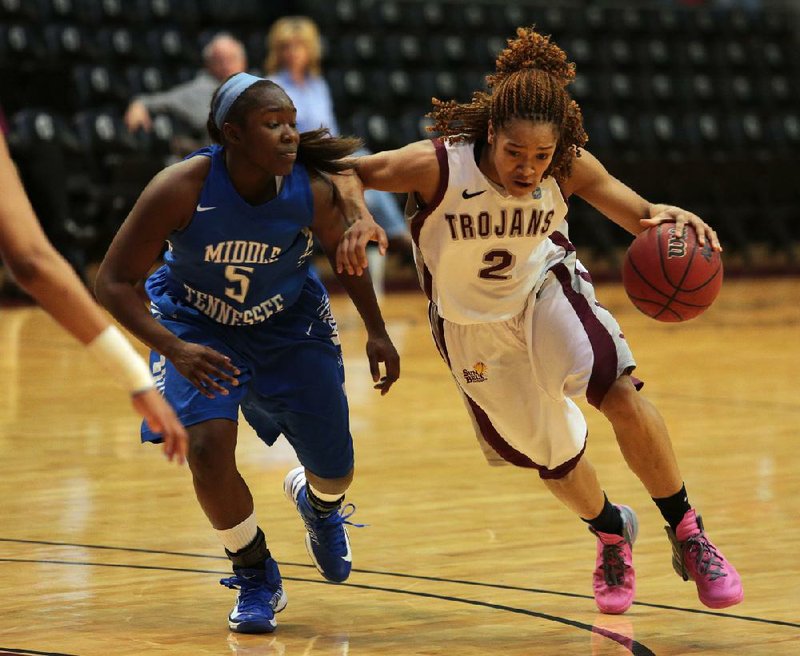 UALR guard Taylor Ford drives to the basket during the Trojans victory over Middle Tennessee