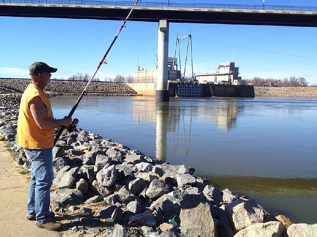Donald Barber of Oak Grove waits for a catfish to bite Thursday below the hydroelectric plant at Cook's Landing in North Little Rock.
