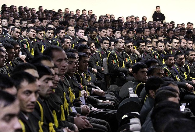 Afghan military officers listen to President Hamid Karzai’s address Saturday in Kabul. 