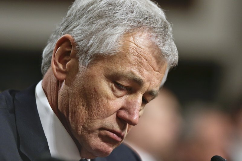 FILE - In this Jan. 31, 2013, file photo Republican Chuck Hagel, a former two-term GOP senator from Nebraska and President Obama's choice for Defense Secretary, testifies before the Senate Armed Services Committee during his confirmation hearing on Capitol Hill in Washington. A Senate panel on Wednesday, Feb. 6, 2013, abruptly postponed a vote on Chuck Hagel's nomination to be defense secretary amid Republican demands for more information from President Barack Obama's nominee about his paid speeches and business dealings.