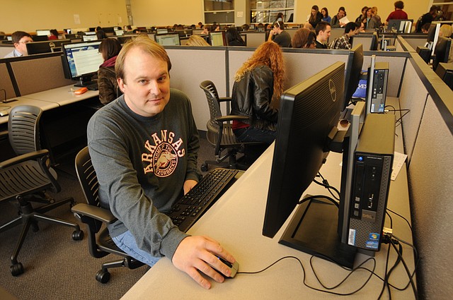 Jonathan Noble sits at a computer in the computer lab at the University of Arkansas student union Feb. 5 after a class. When handing out lottery scholarships, the state puts a cap on the number of nontraditional students who may receive them, despite the fact that those students are considerably more successful at finishing college than their traditional counterparts.