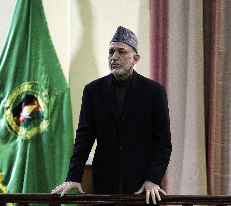 Afghan President Hamid Karzai addresses military officers in Kabul on Saturday. 