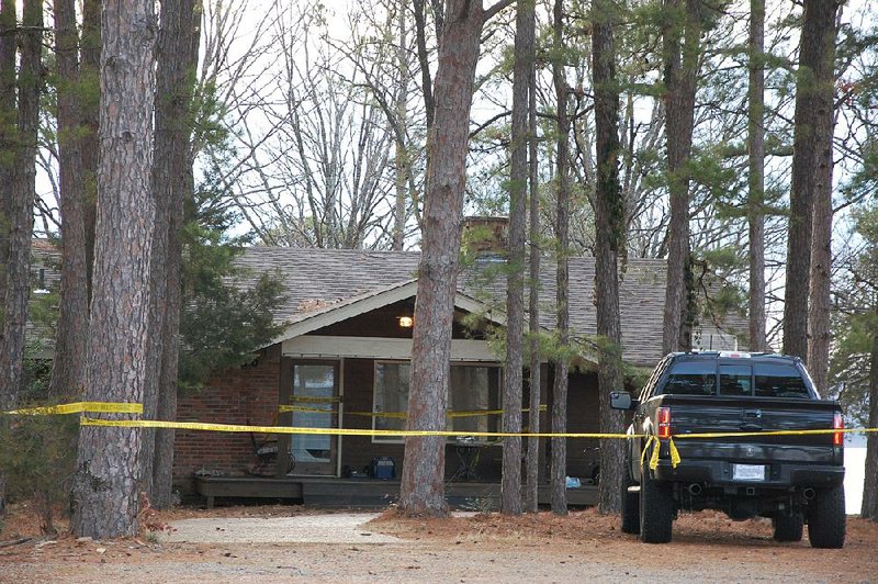 Yellow crime-scene tape blocks off the home of Mindy McCready in Heber Springs on Monday, the day after the country singer was found dead there of an apparent suicide. She was 37. 