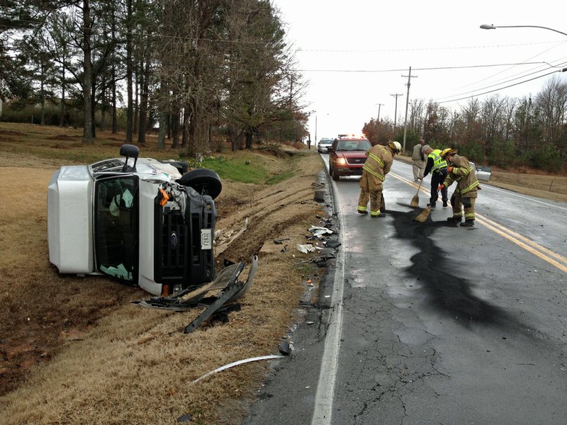 Crews respond Monday, Feb. 18, 2013, to an accident at Remount and Perin roads in North Little Rock.