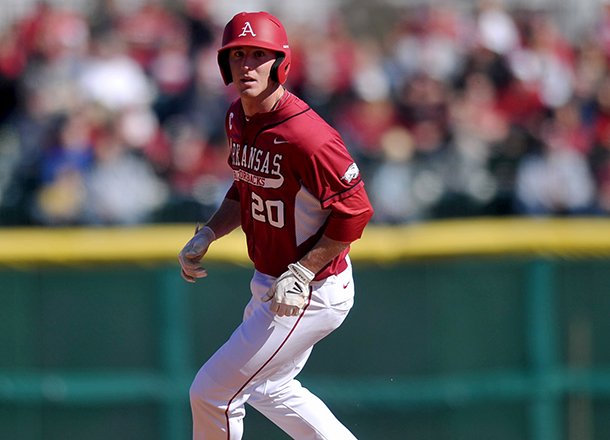 Arkansas' Matt Vinson rounds second base after advancing in the third inning of Sunday afternoon's game at Baum Stadium in Fayetteville.