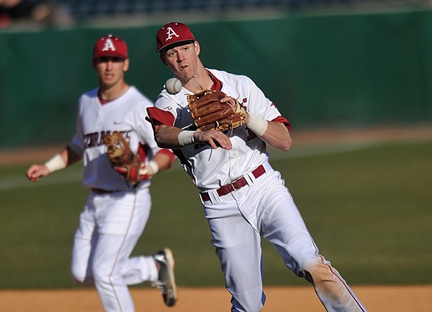 Arkansas third baseman Brian Anderson fields the ball as he makes a play for an out in the sixth inning of the first game in Tuesday afternoon's doubleheader against New Orleans at Baum Stadium in Fayetteville.
