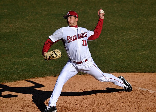 Arkansas freshman Colin Poche delivers a pitch during the Razorbacks' 14-0 win over New Orleans in the first game of a doubleheader Tuesday at Baum Stadium in Fayetteville. 