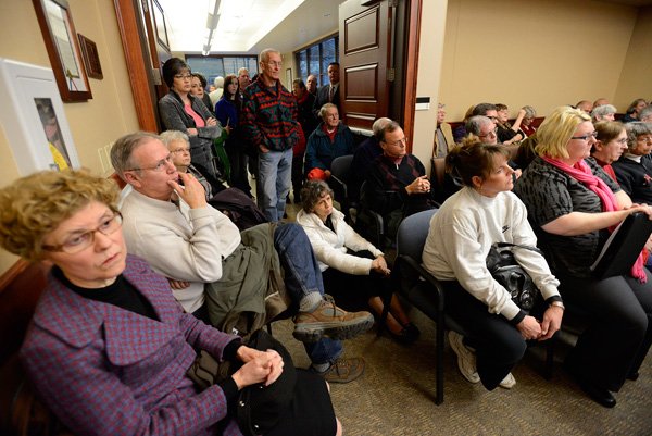 Bentonville residents fill the Planning Commission meeting room Tuesday, Jan. 15, 2013, during a public hearing on the proposed North Walton Boulevard corridor enhancement plan at the Community Develpoment Building. Several residents voiced their concerns at the meeting over plan's extension of Northwest 5th Street to North Walton Boulevard.