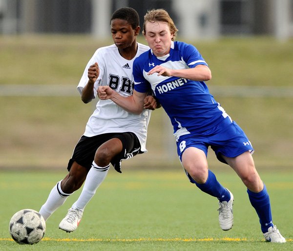 Tolliver Davis, left, will have an expanded role for Bentonville’s boys soccer team this season as the junior moves from midfielder to a forward role. 