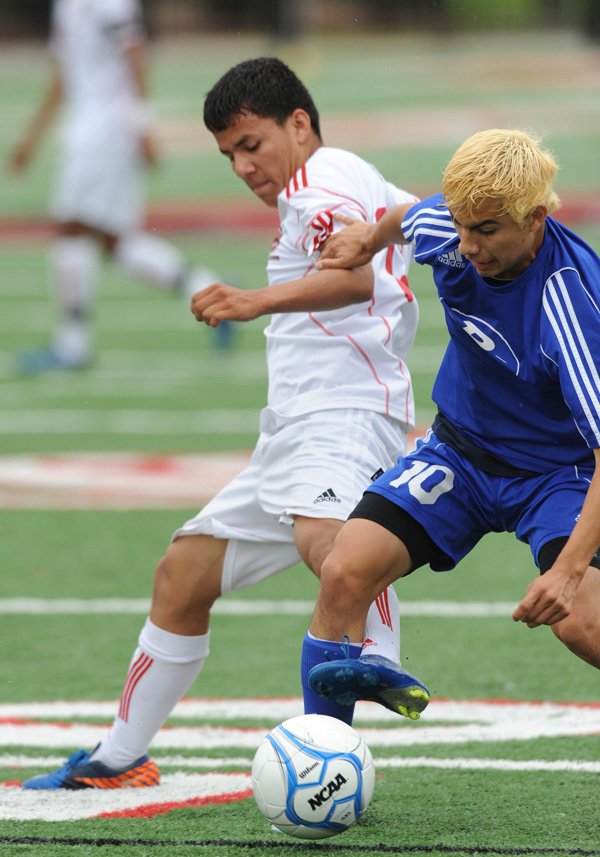 Danny Garcia, Rogers High defender, collects the ball May 11 at Northside High School in Fort Smith. 
