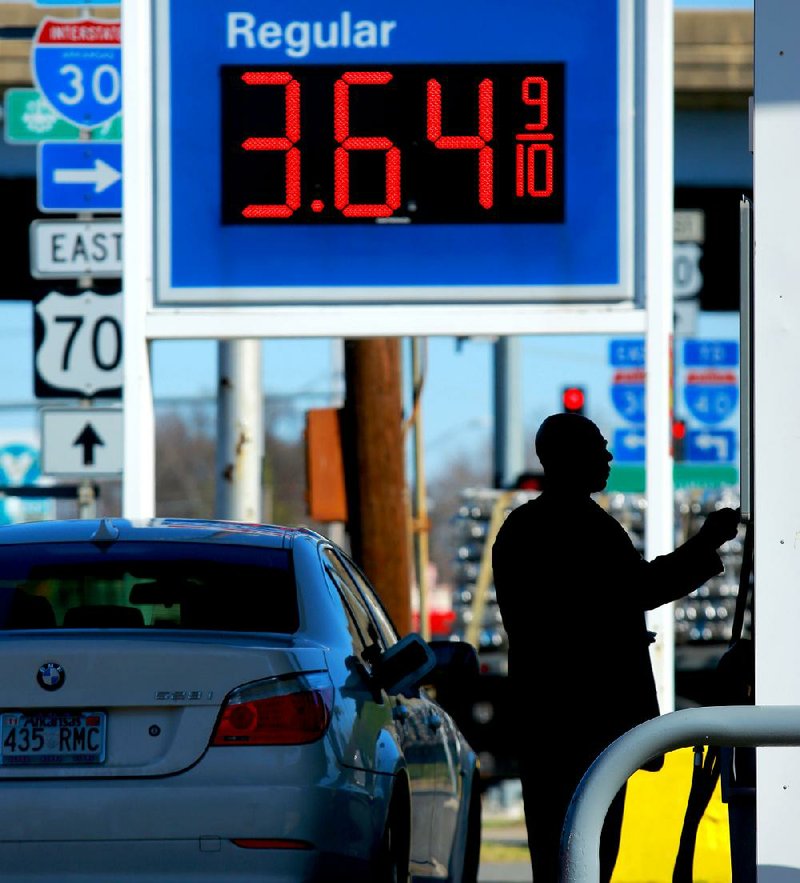 
A man prepares to gas up for $3.64 a gallon at an Exxon station at Broadway and I-30 in North LIttle Rock Tuesday afternoon. Arkansas average rule price have jumped nearly $.50 a gallon in the past month.