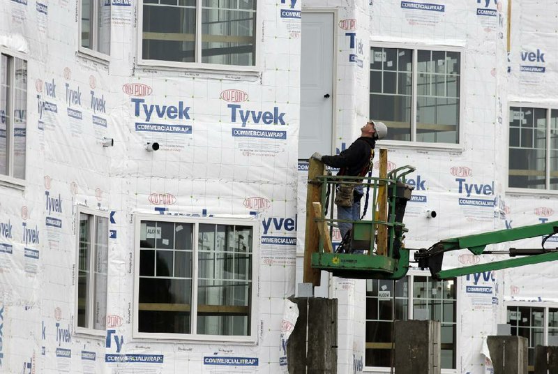 In this Friday, Jan. 11, 2013 photo, a construction worker works at a new home under construction in Chicago. U.S. homebuilders began work at a slower pace in January, though the level was still the third-highest since 2008. The pace of building was viewed as a sign of further strengthening in residential real estate. (AP Photo/Nam Y. Huh)