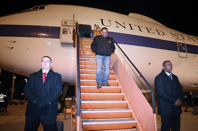 Outgoing Defense Secretary Leon Panetta steps off the E-4B aircraft after landing in Brussels, Belgium, Wednesday, Feb. 20, 2013. Panetta is in Brussels for a NATO defense ministers meeting. (AP Photo/Chip Somodevilla, Pool)