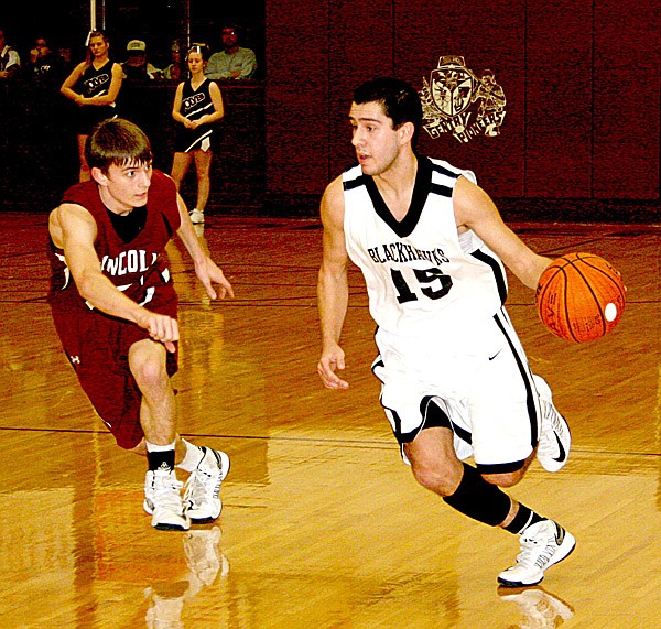 Nick DeLeon, a Pea Ridge senior guard, brings the ball down the court against Lincoln on Feb. 15 in Gentry. 