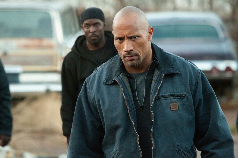 John Matthews (Dwayne Johnson) is an honest man who gets involved with the drug trade to free his son from prison in the dramatic thriller Snitch. 