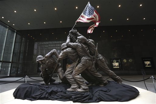 The original 12 1/2-foot (4 meter) cast stone version of Felix de Weldon's iconic statue depicting soldiers raising the U.S. flag at Iwo Jima is on display, Friday, Feb. 22, 2013. The smaller original statue, which was removed in 1947 and hidden under a tarp at the artist's studio for four decades, is expected to fetch up to $1.8 million when it goes on sale at Bonham's auction house in New York on Feb. 22, 2013. 