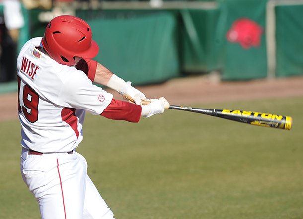 Arkansas junior Jake Wise connects for a two-run home run Friday, Feb. 22, 2013, during the second inning of play against Evansville at Baum Stadium in Fayetteville.