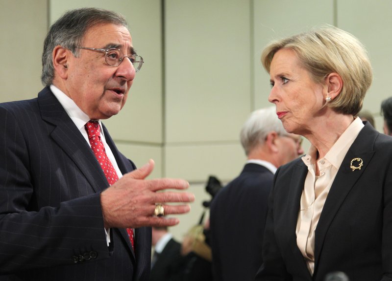 U.S. Secretary of Defense Leon Panetta, right, talks with his Norwegian counterpart Anne-Grete Strom-Erichsen, at the start of a two-day NATO defense ministers meeting to discuss Syria and Afghanistan, at NATO headquarters in Brussels, Thursday, Feb. 21, 2013. The head of NATO urged member countries Thursday to stop cutting their defense budgets in response to tough economic times, saying continued reductions will compromise the safety of all of the military alliance’s 28 members.