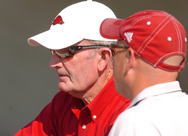 John McDonnell (left) spent 30 years as Arkansas' track & field and cross country coach. 