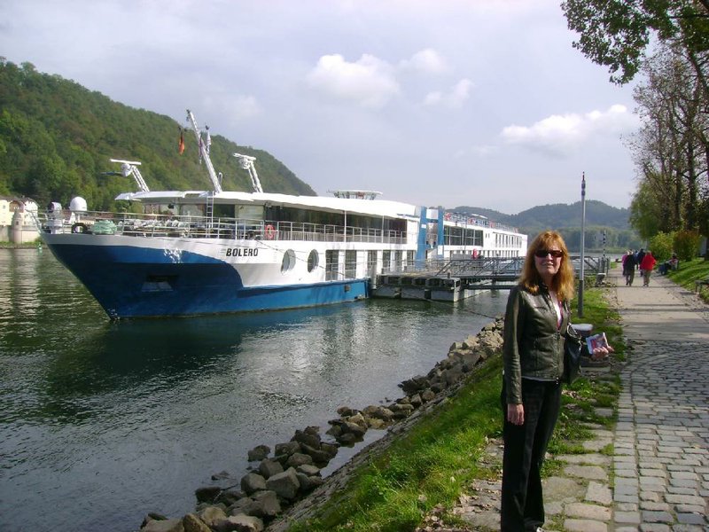 Betty Adams pauses near the MS Bolero, the river boat she and her husband almost didn’t get to take. 