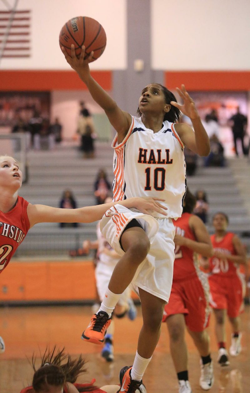 Little Rock Hall’s Tyler Scaife (10) is fouled by Fort Smith Northside’s Olivia Hanson while driving to the basket during the Warriors’ 73-64 victory over the Lady Bears on Friday at Cirks Arena in Little Rock. 